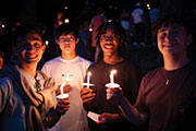 Students holding candles