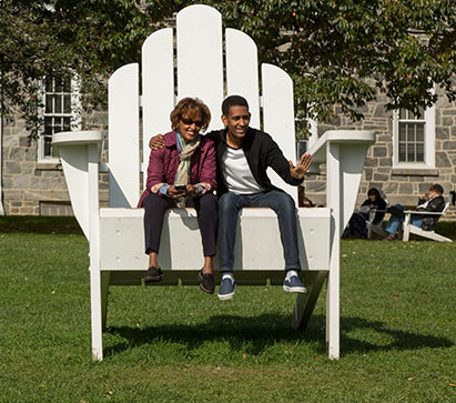 Photo of two people sitting on a large chair. Links to Gifts That Protect Your Assets