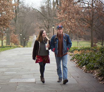 Two students walking together outside. Links to Beneficiary Designations Two students walking together outside. Links to Beneficiary Designations