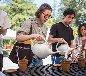 Students watering plants. Links to Gifts of Appreciated Securities Students watering plants. Links to Gifts of Appreciated Securities