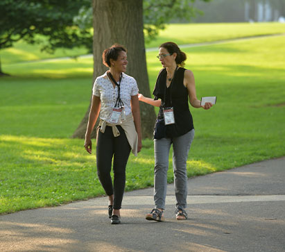 Photo of two women walking on campus. Links to Gifts of Cash, Checks, and Credit Cards